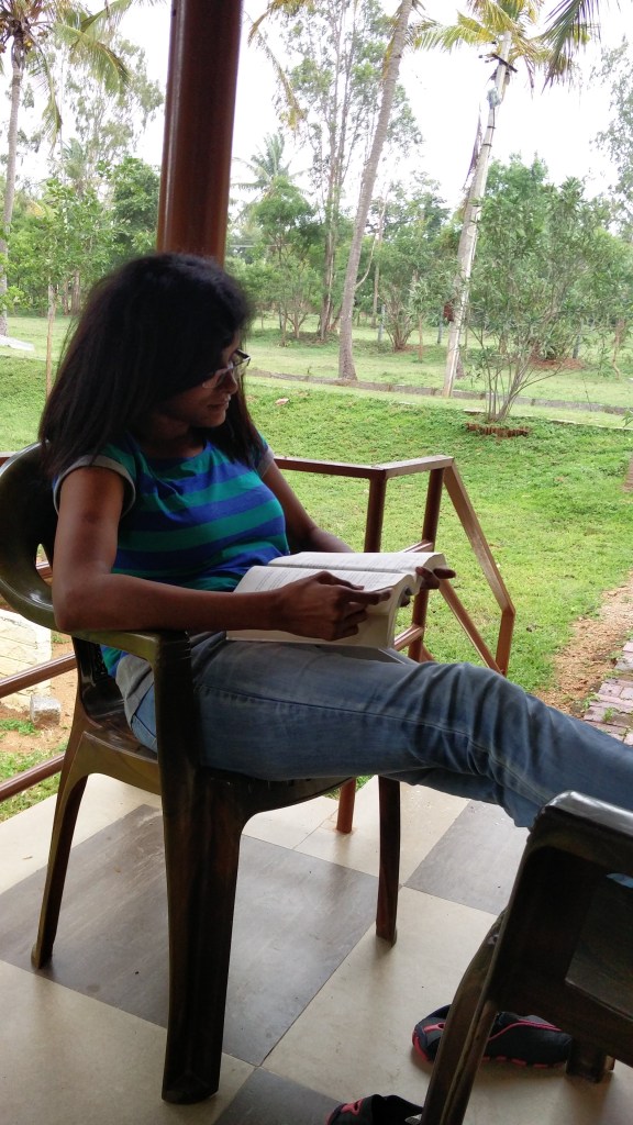 An old picture of mine reading a book on one of my travels.